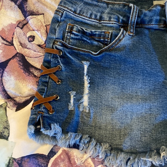 Lace up stretchy jean shorts. - Picture 3 of 5